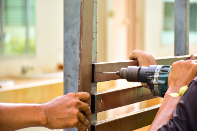 Fence Repair by 2 workers with tools